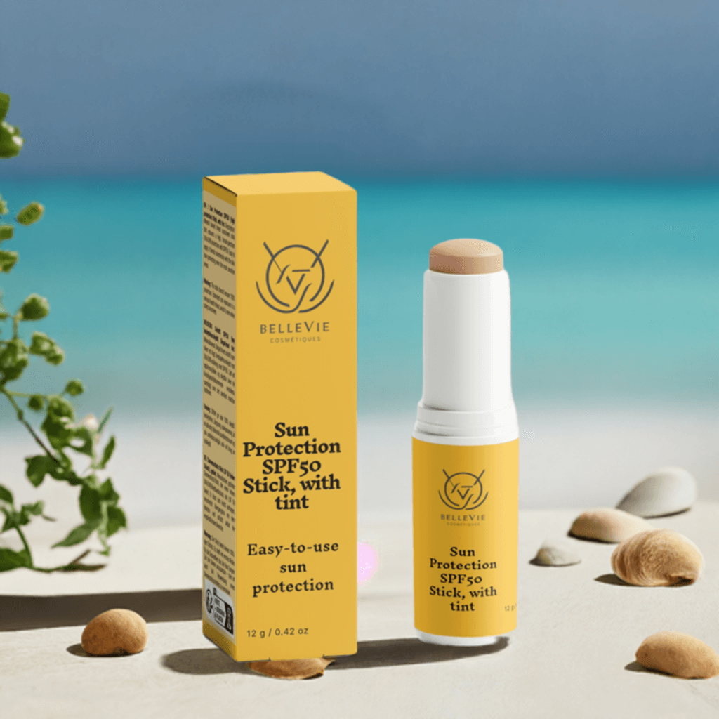 Tinted SPF50 mineral sunscreen stick by BelleVie Cosmétiques with zinc oxide and titanium dioxide, no white cast visible.