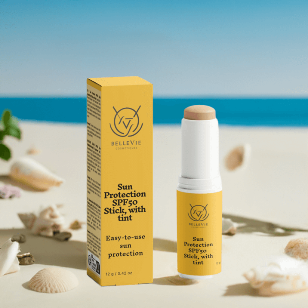 Tinted SPF50 mineral sunscreen stick by BelleVie Cosmétiques with zinc oxide and titanium dioxide, showing the compact sun protection product.