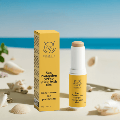 Tinted SPF50 mineral sunscreen stick by BelleVie Cosmétiques with zinc oxide and titanium dioxide, showing the compact sun protection product.