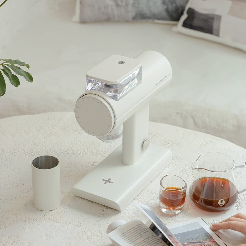 Timemore Electric Coffee Grinder Sculptor 078SSP with stainless steel body and adjustable grind settings on a kitchen countertop.