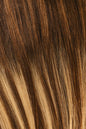 Rachel Paige XO Luxury Signature Weft Collection hair extensions in a natural blonde shade, displayed on a mannequin head.