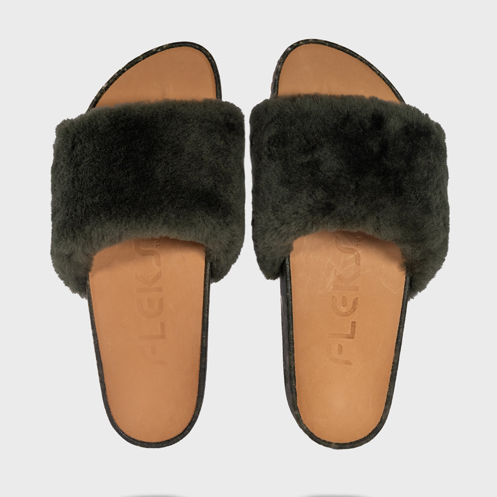 Fleks San Ysidro Slide in Forest color, top-down view showing sleek design and vibrant green strap on the slide.