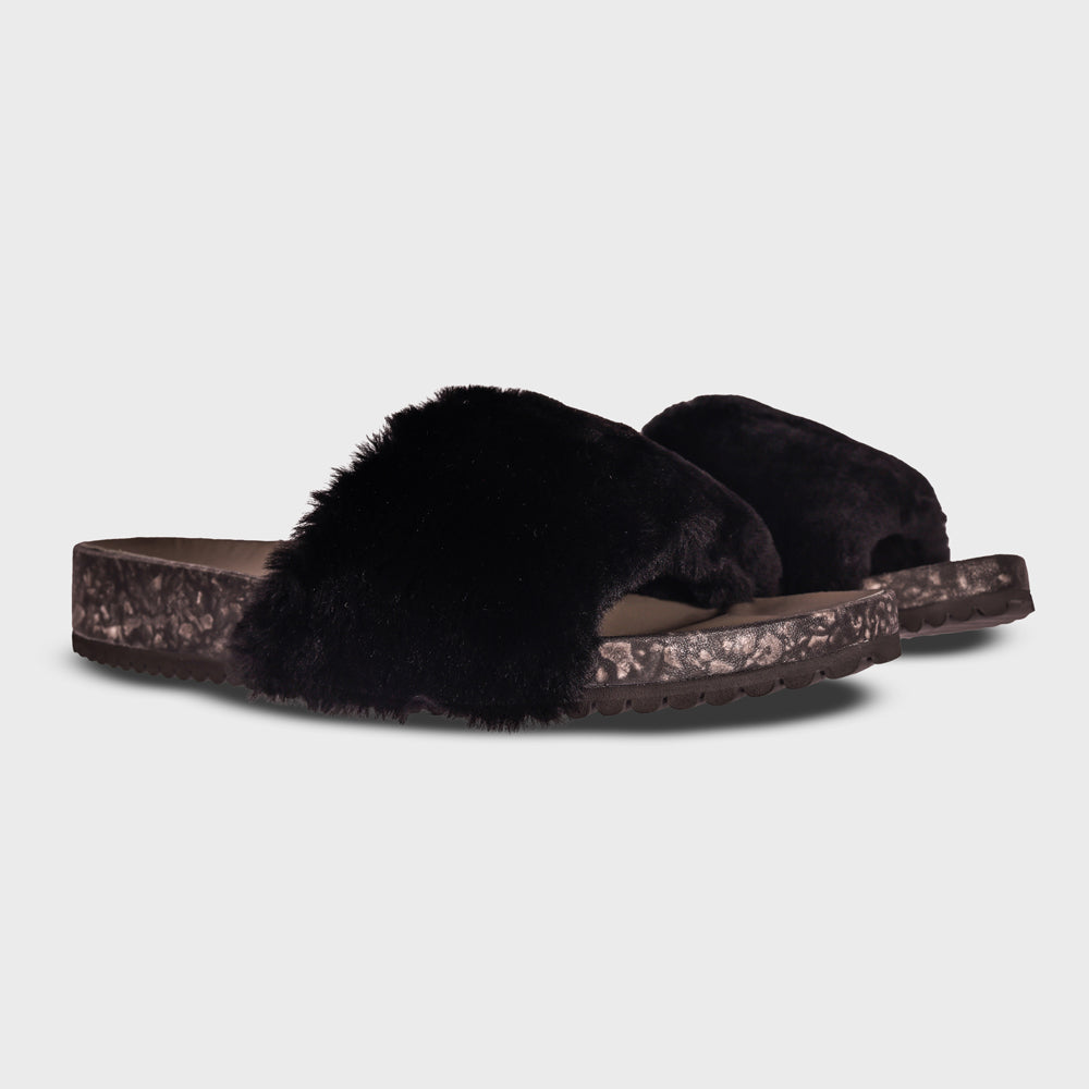 Pair of Fleks San Ysidro Slide sandals in Raven color, showing the stylish slip-on design from an angled view