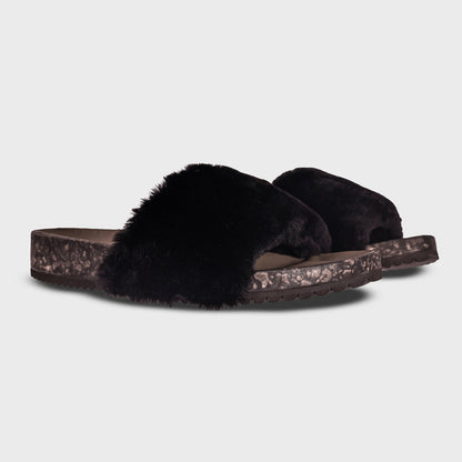 Pair of Fleks San Ysidro Slide sandals in Raven color, showing the stylish slip-on design from an angled view