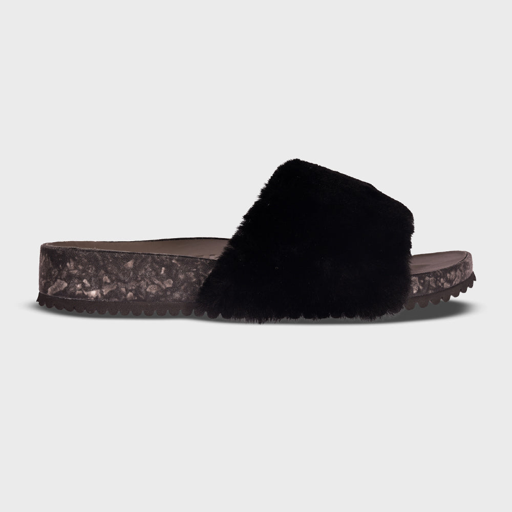 Fleks San Ysidro Slide Raven, single profile view showing black slide sandal with sleek design and open toe.