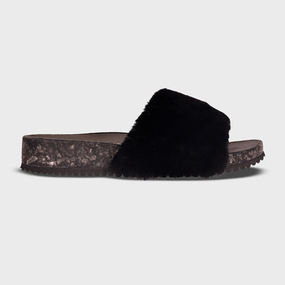 Fleks San Ysidro Slide Raven, single profile view showing black slide sandal with sleek design and open toe.