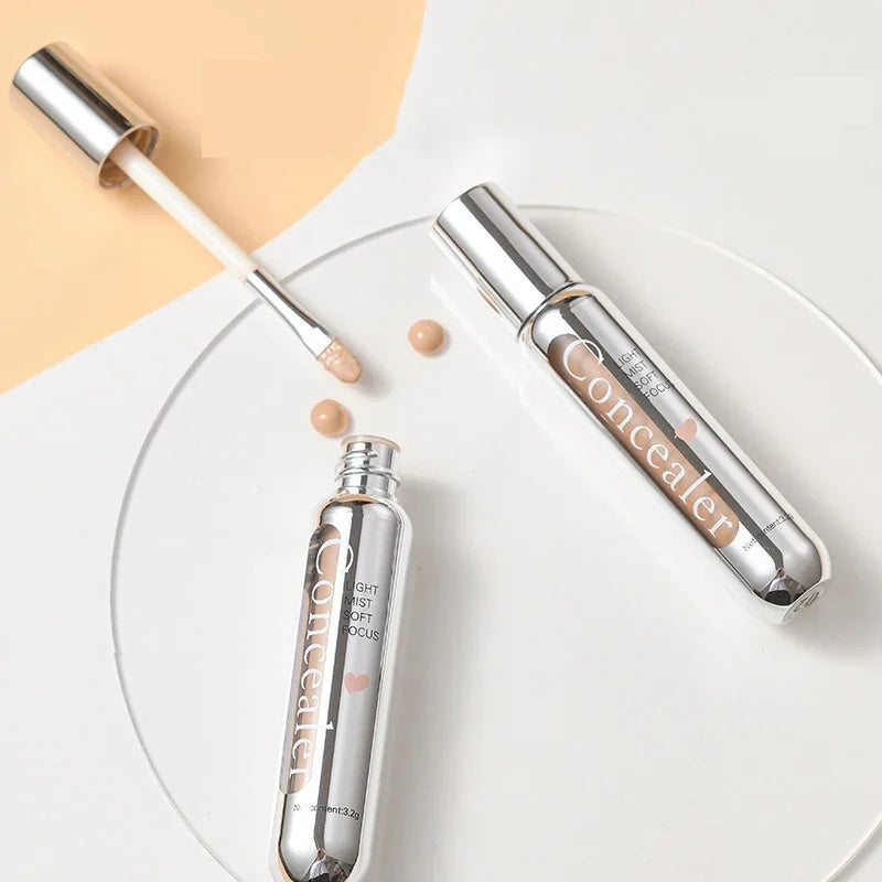 Blushimmer lightweight concealer pen with brush for covering dark circles, acne, and contouring in a liquid, cream, or stick format.