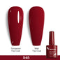 Bright neon pink gel nail polish by Blushimmer, showing a glossy, vibrant UV-reactive nail art design in a salon setting.