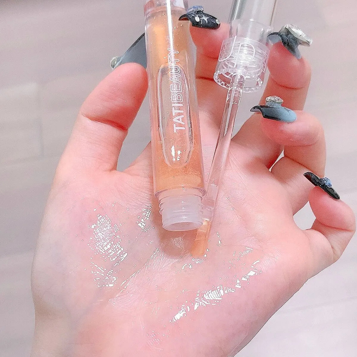 Blushimmer Lip Oil Uuny transparent water gloss with honey scent, moisturizing lip glaze in a clear glass tube, ideal for students