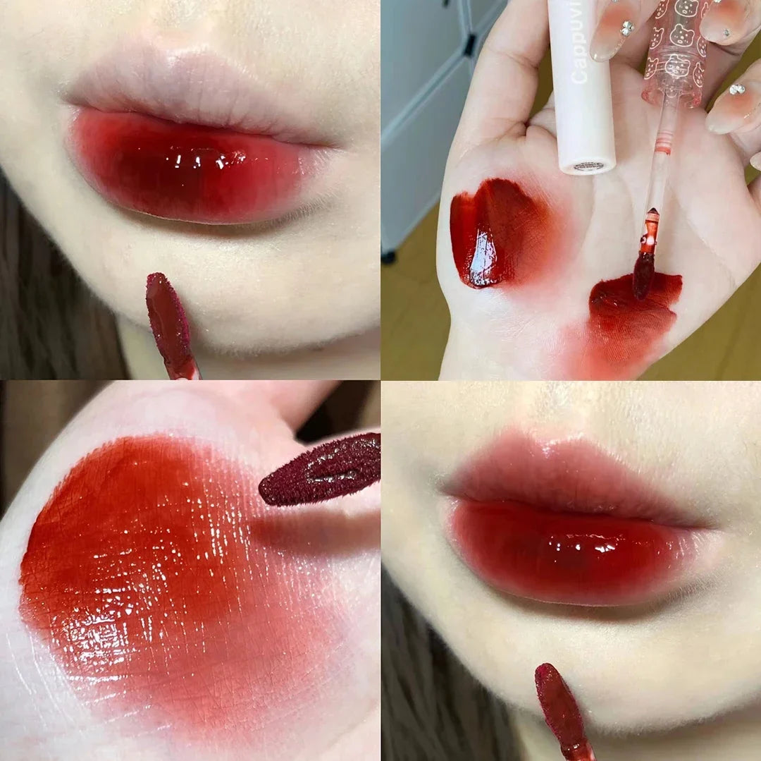 Cherry Pink Mirror Water Lip Gloss by Blushimmer, moisturizing glass lip oil with a shiny pink cherry tint, displayed in a clear tube.