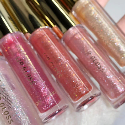 Blushimmer water-glossy lip gloss with a sparkling, moisturizing finish on plump, shiny lips.