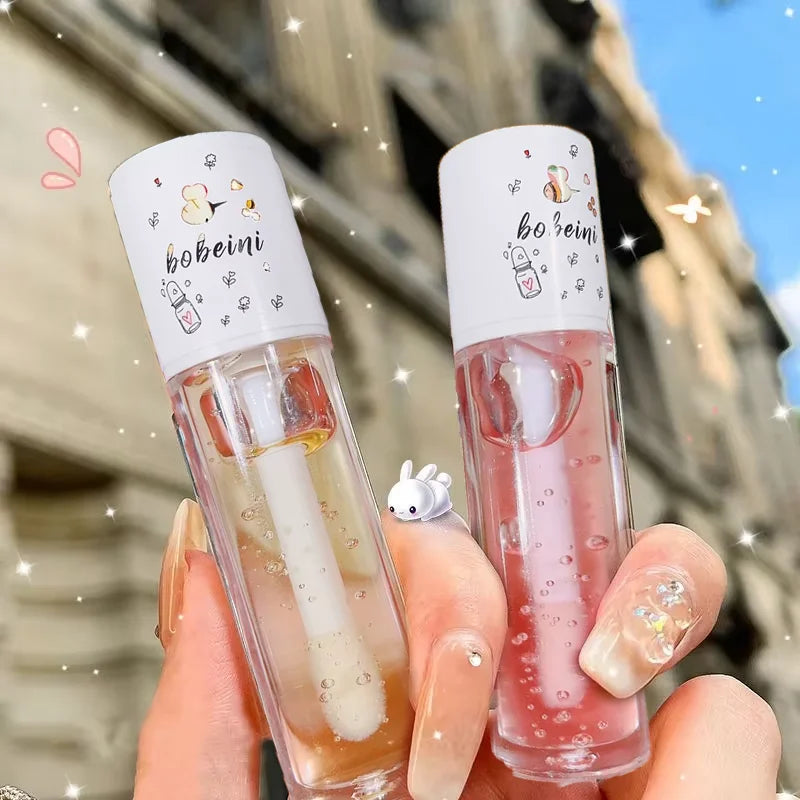 Blushimmer Peach Milk Lip Oil and Bee Lip Balm with moisturizing, soothing, and hydrating properties for dry, cracked lips.