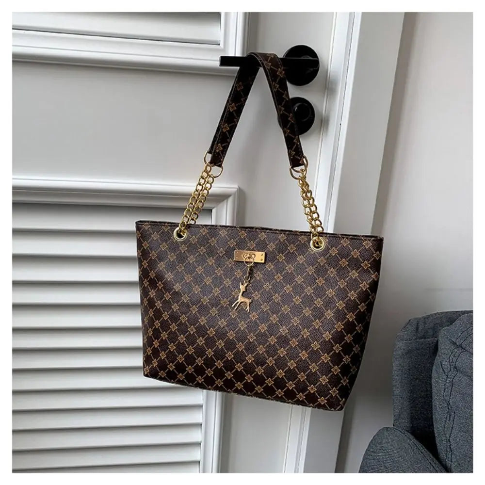 Luxury women tote bag with large capacity, printed design, shoulder strap, trendy handbag for shopping and daily use.