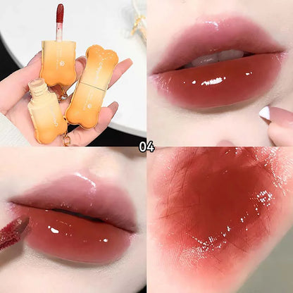 Blushimmer Pinkcoco Bear Doodle Mirror Lip Glaze with shiny finish, nude lipstick, and playful bear design in the mirror.