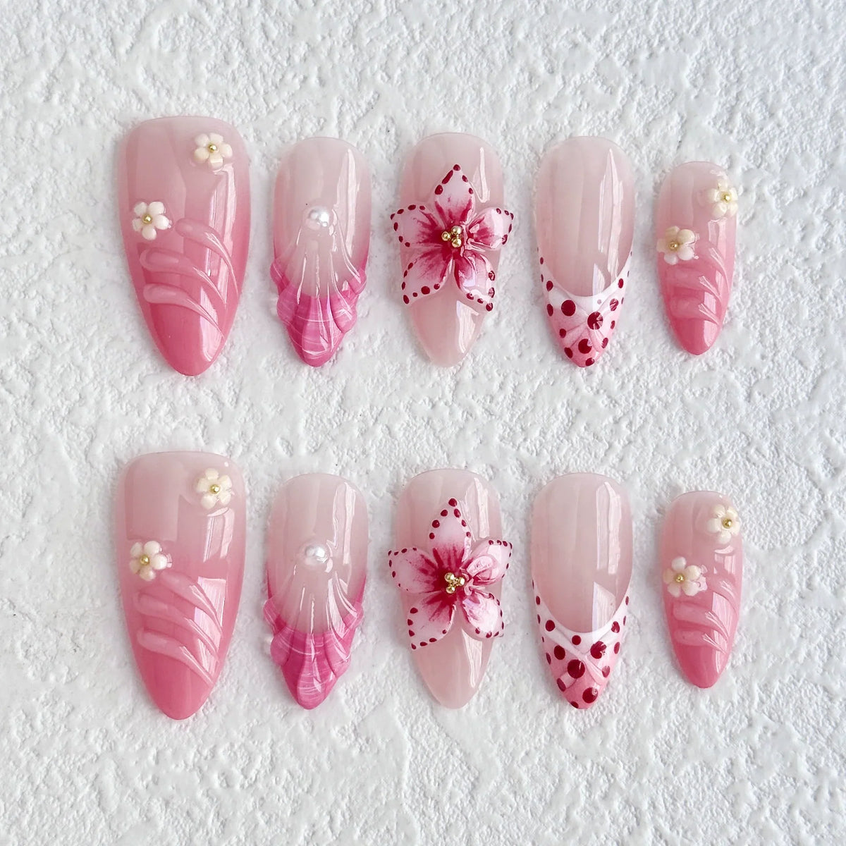 Set of 10 French almond press-on nails with flower design by Blushimmer, wearable false nails for easy application and natural look.