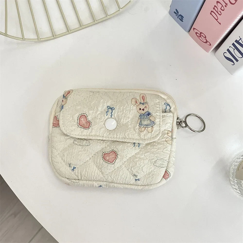 Blushimmer cute cartoon small travel cosmetic bag with lipstick, earphone, card storage, and makeup organizer for women.