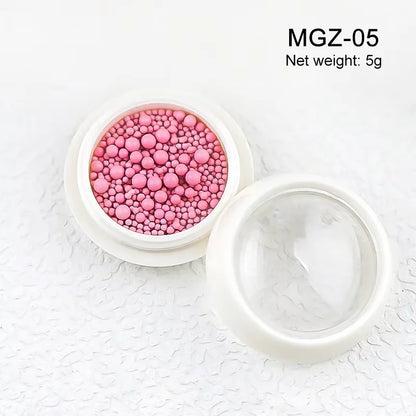 White acrylic flower nail art decorations with mixed size red and blue rhinestones for DIY manicure design by Blushimmer.