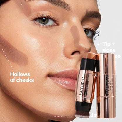 Blushimmer double-head face bronzer contour stick with light and dark shades and brush for facial contouring and brightening.