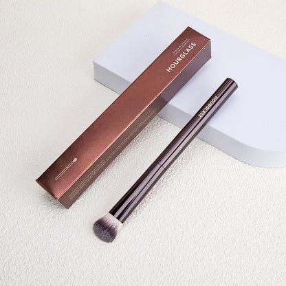 Blushimmer seamless finish concealer brush with angled design for liquid and cream concealer application on face.