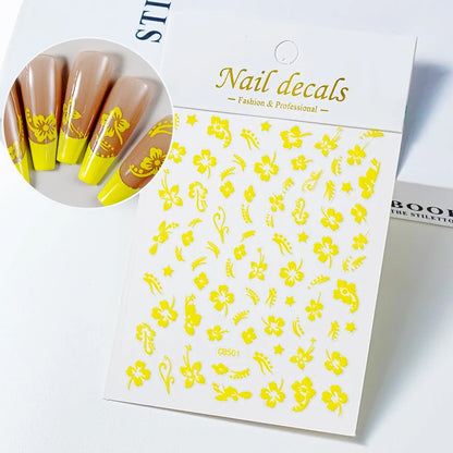 White and black 3D hibiscus flower nail stickers with pink and gold accents, adhesive floral decals for nail art decoration.