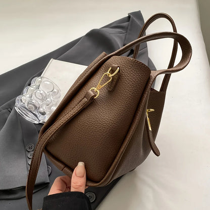 NNEOBA women's multifunctional crossbody handbag with adjustable strap, sleek design, and multiple compartments for accessories.