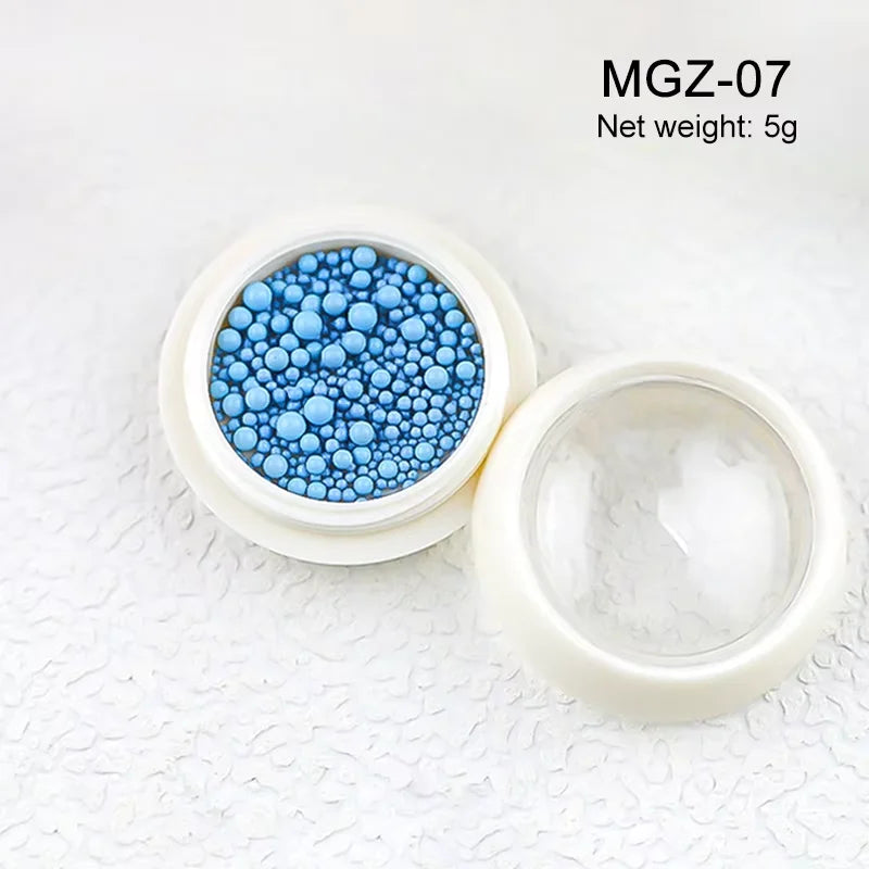 White acrylic flower nail art decorations with mixed size red and blue rhinestones for DIY manicure designs, by Blushimmer.