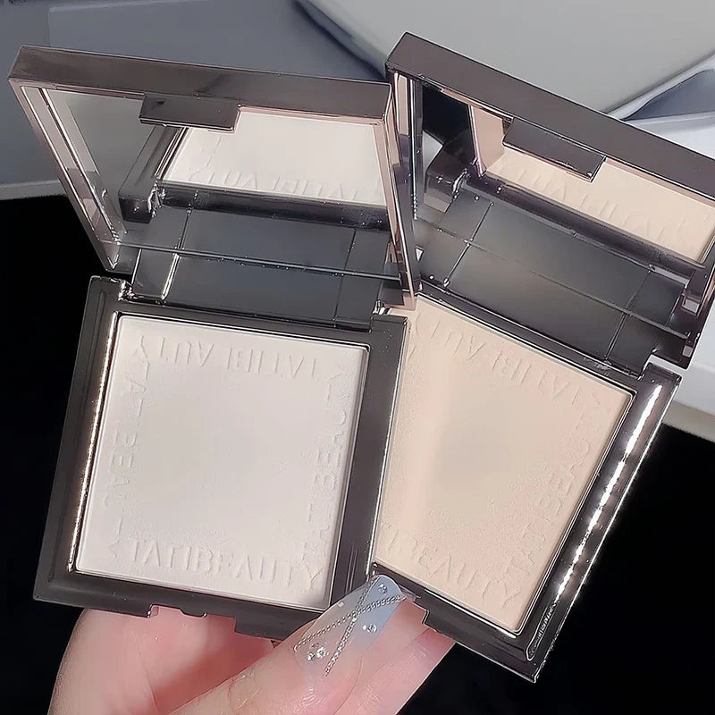 Small silver container of Blushimmer TATIBEAUTY soft focus loose setting powder for oil control and pore concealing.