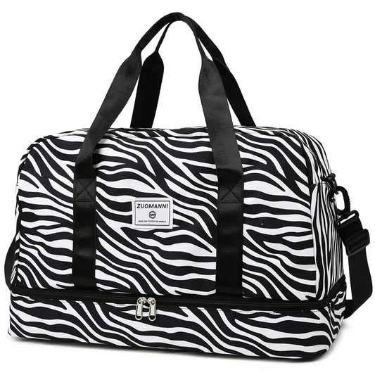 OBA women's zebra print carry-on travel bag with durable duffel bag design for gym and travel use.