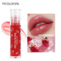 Transparent glass lip gloss by Blushimmer with mirror-like finish and crystal jelly texture, moisturizing and plumping lip makeup.