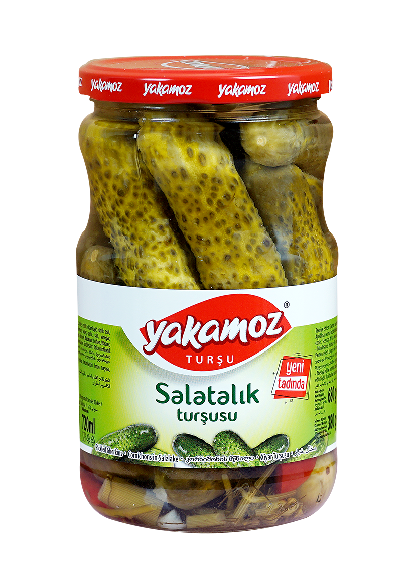 Glass jar of S101 Yakamoz cucumber pickles with fresh, crunchy cucumbers in brine, labeled as cucumber salad in a clear jar.