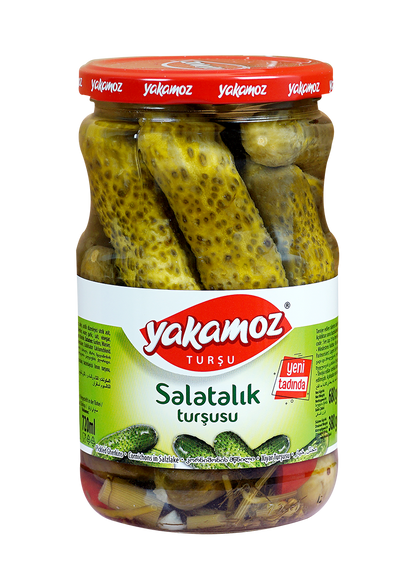 Glass jar of S101 Yakamoz cucumber pickles with fresh, crunchy cucumbers in brine, labeled as cucumber salad in a clear jar.