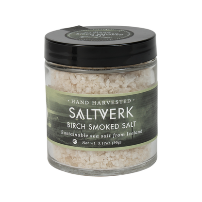 Saltverk birch smoked salt crystals in a glass jar, showcasing the artisanal salt with a smoky flavor and natural wood infusion.