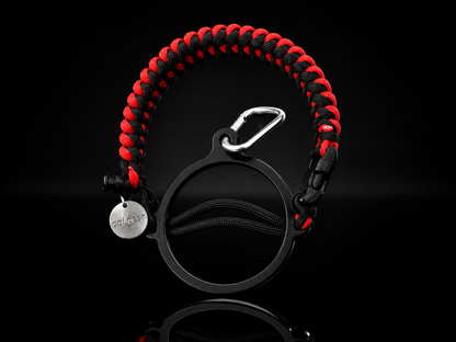 Coldest Paracord Handle accessory with red and black design, featuring durable paracord grip on a dark background.