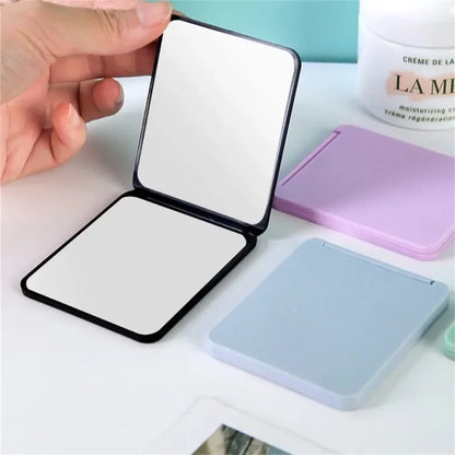 Portable double-sided foldable makeup mirror by Blushimmer, compact desktop design, ideal for students and small gift options.