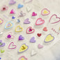 Colorful Cat's Eye 5D gradient European love heart gem nail art stickers with crystal and geometric designs for manicure decoration.
