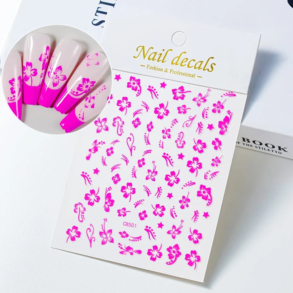 White and black 3D hibiscus flower nail sticker with pink and gold accents, adhesive floral decal for nail art decoration by Blushimmer.