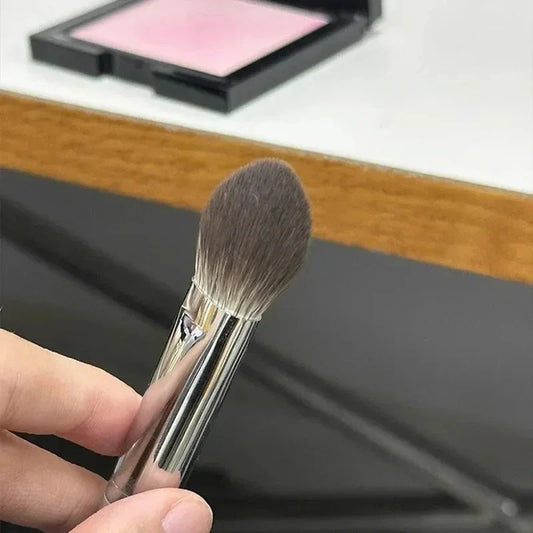 Blushimmer peach heart-shaped blusher brush with small flat design for powder, cream, and liquid blush makeup application.