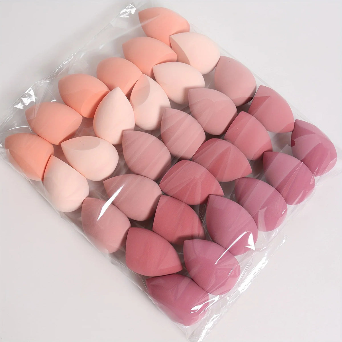 Blushimmer 7 or 18-piece makeup sponge set with dual-use liquid and powder puffs, including makeup eggs for wet or dry application.