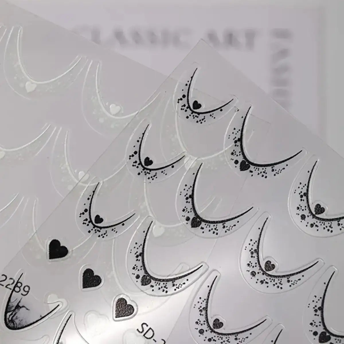 Blushimmer 12-sheet gradient French tip nail stickers with heart design, self-adhesive decals for DIY nail art in 12 colors.