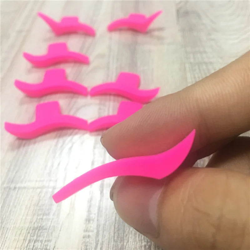 Two black eyeliner stencil templates from Blushimmer, featuring wing and cat eyeliner shapes for precise eye makeup application.