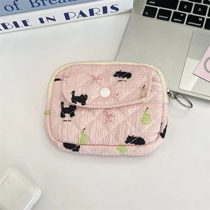 Cute cartoon small travel cosmetic and lipstick storage bag by Blushimmer, featuring earphone and card compartments, portable purse.