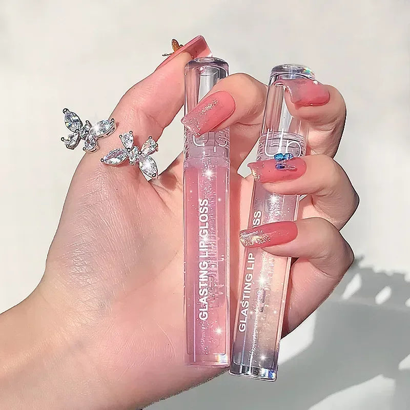 Blushimmer transparent glass lip gloss with water-inspired shine, glossy finish, and waterproof, long-lasting liquid lipstick on lips.