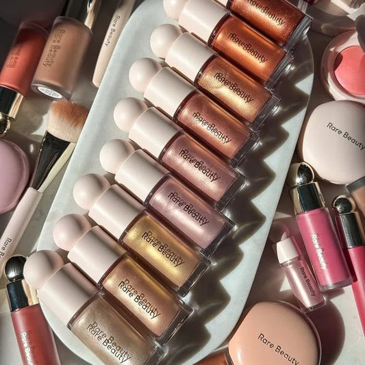 Blushimmer Rare Beauty shimmer glitter liquid blush highlighter with gel texture and natural contour for glowing face makeup.