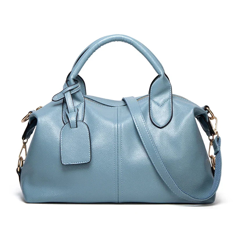 OBA women's large capacity oil wax leather tote bag with shoulder straps, showcasing its spacious design and textured leather finish.