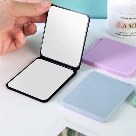 Blushimmer foldable double-sided makeup mirror with compact design, portable and ideal for dorms or home decor.