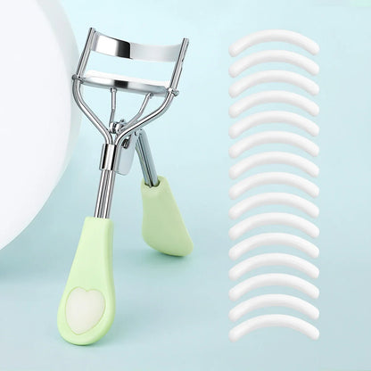 Blushimmer portable eyelash curler with stainless steel body and 15 silicone pads, designed for eyelash extension and curling.