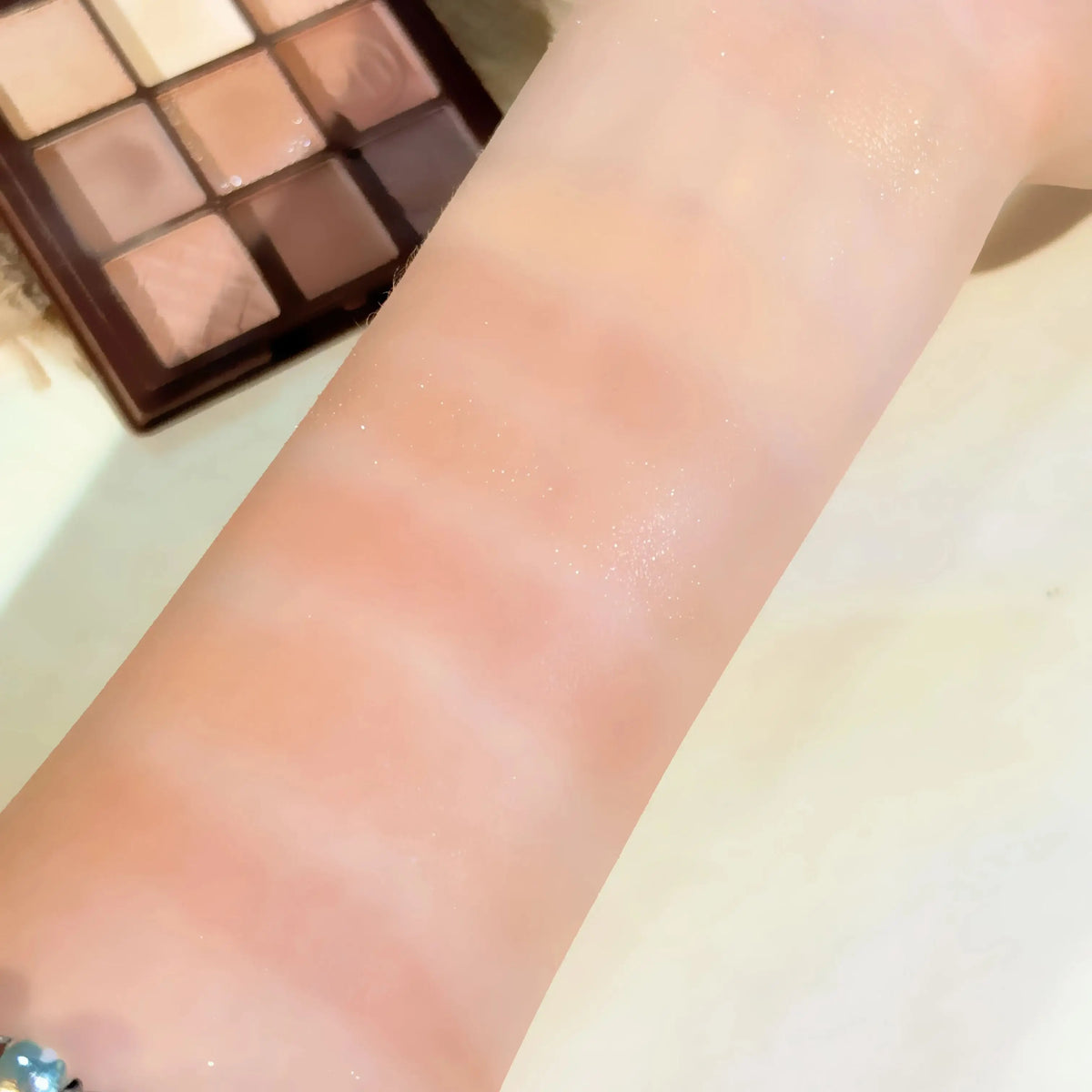 Blushimmer Chocolate Warm Brown Earth Palette eyeshadow with 9 matte, orange, brown, pearlescent, and glitter shades for eye makeup.