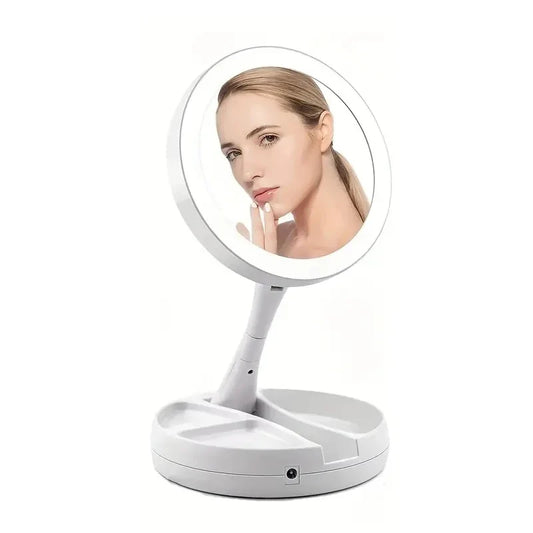 Blushimmer compact LED travel makeup mirror with 10X magnification, double-sided, folding design and built-in lights.