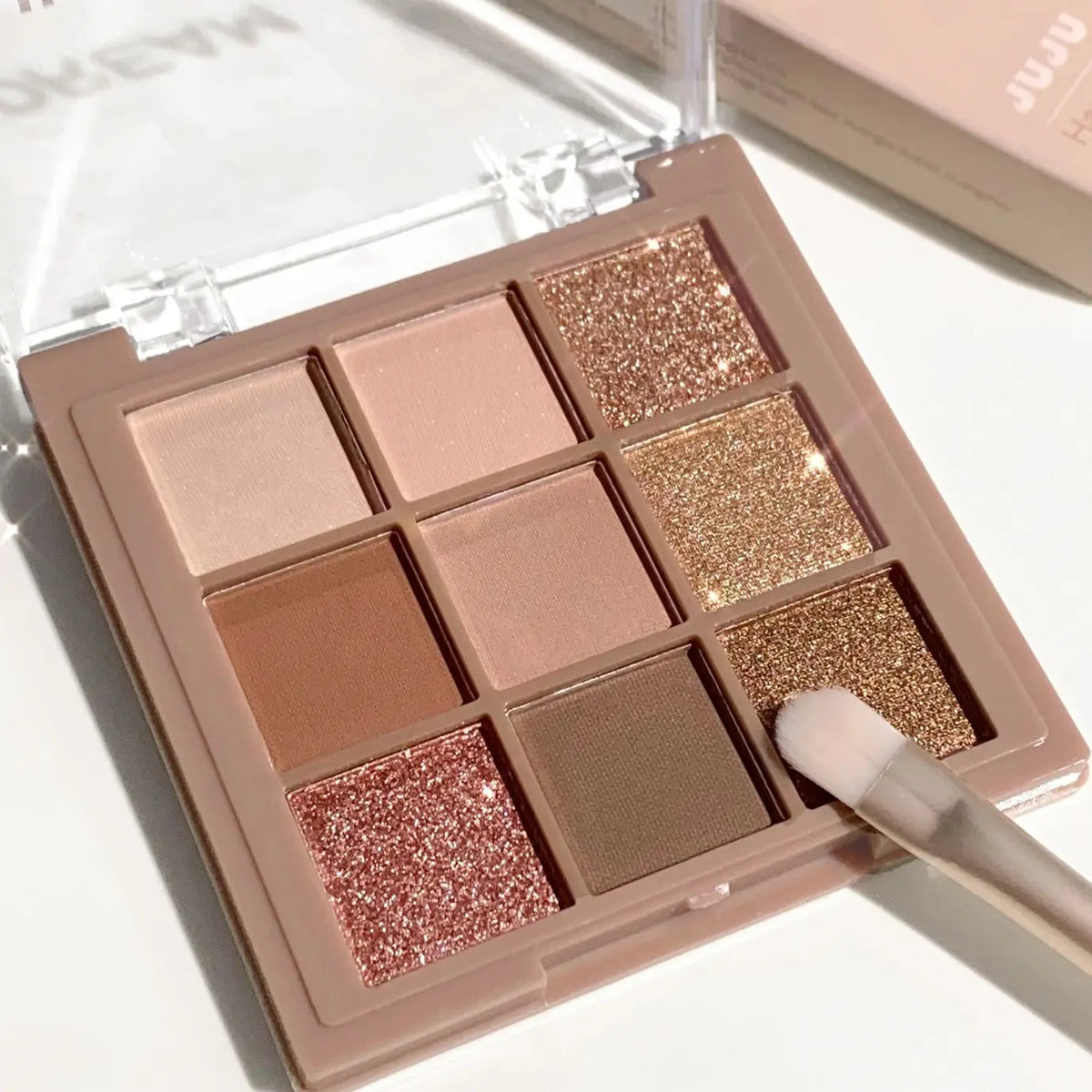Blushimmer 9-18 color eyeshadow palette with velvet matte and shimmer shades in berry, brown, and nude tones, waterproof and luxurious.