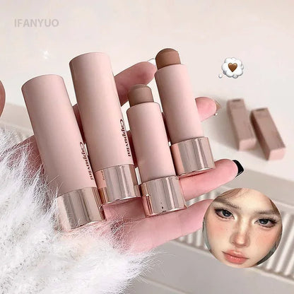 Gray and brown bronzer contouring stick by Blushimmer with waterproof, creamy texture for face shaping and concealing.